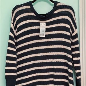 Brand new striped sweater with bows on the sides.